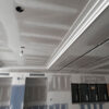 Installed New York 2-Step Crown Molding for LED's creating a stepped recessed ceiling detail in an interior under construction.