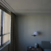 Installed New York 2-Step Crown Molding for LED's creating a clean stepped ceiling transition in a simple interior room.