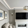 Installed Miami Art Deco 2-Step Crown Molding for LED's creating soft perimeter ceiling illumination in a refined contemporary living space.