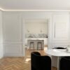 Installed New York 3-Step Crown Molding for LED's creating soft perimeter ceiling illumination in a refined contemporary interior.