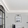 Installed New York 2-Way Molding for Indirect Lighting creating soft perimeter ceiling illumination in a refined contemporary interior.