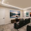 Installed Miami Art Deco Baseboard and Casing adding elegant decorative trim details to a refined home theater interior.